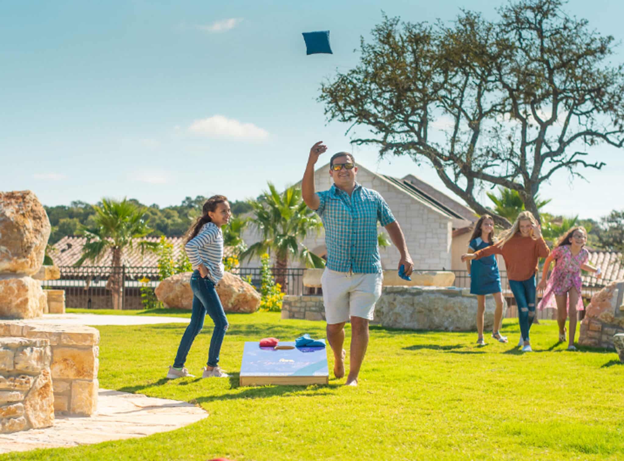 people playing corn hole
