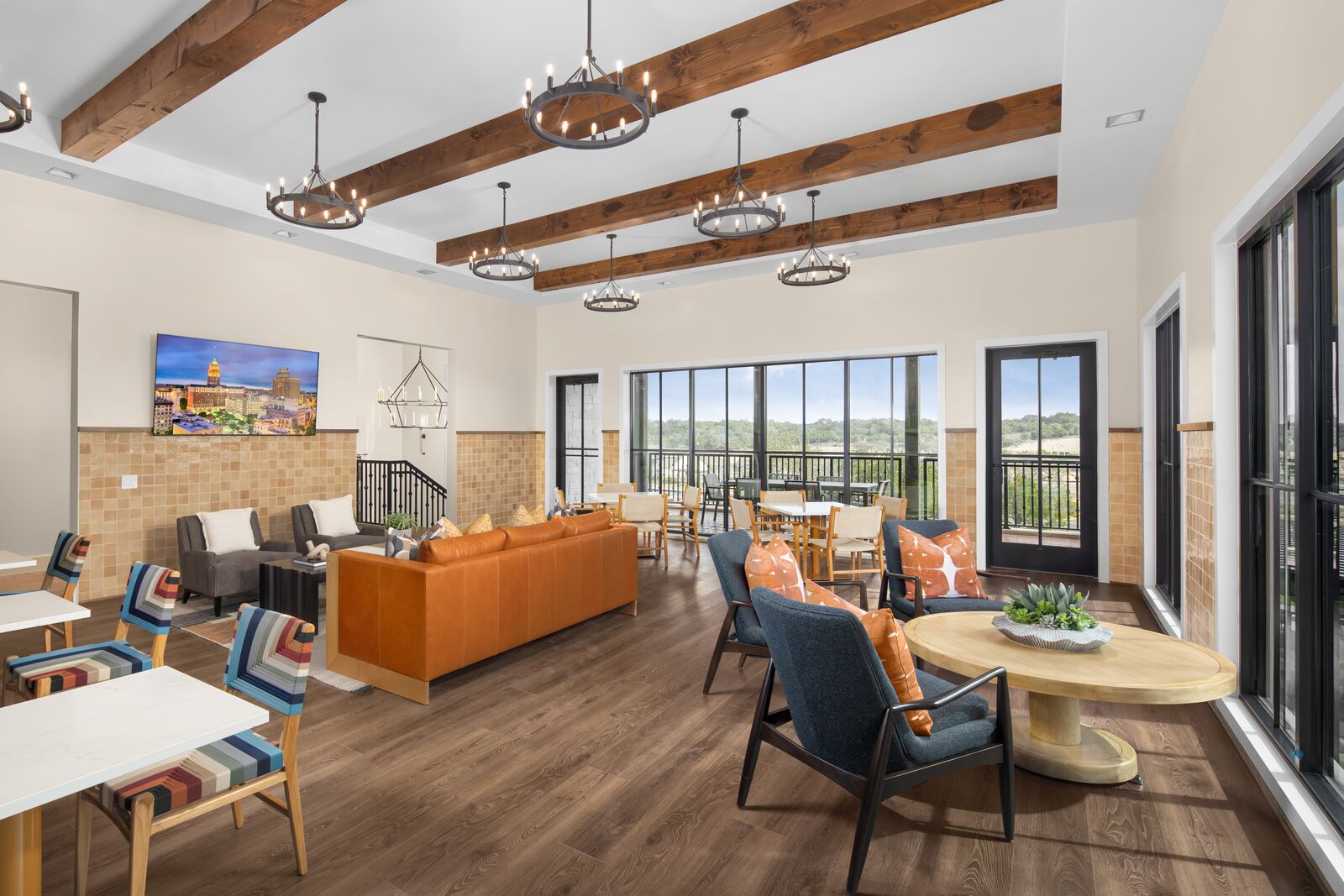 Club lounge with sofas and dining tables at The Hacienda, Regency at Esperanza